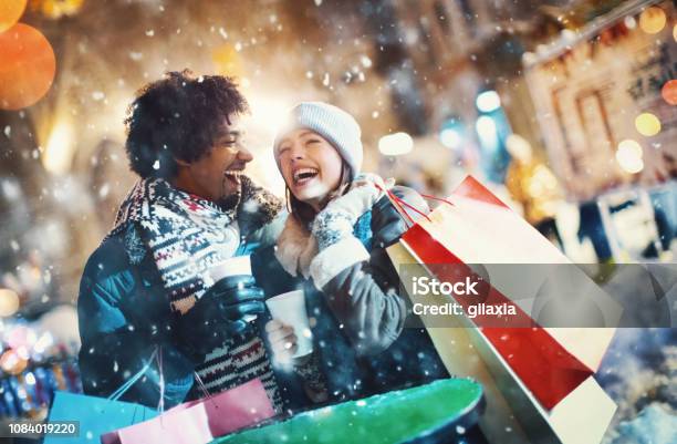 Couple Doing Some Street Shopping Stock Photo - Download Image Now - Shopping, Retail, Christmas