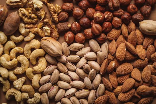 istock flat lay with tasty nuts arrangement on brown background 1084021450
