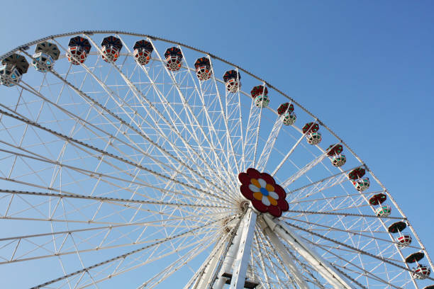 istock Attractions and Wheel in sunny day. 1084026474