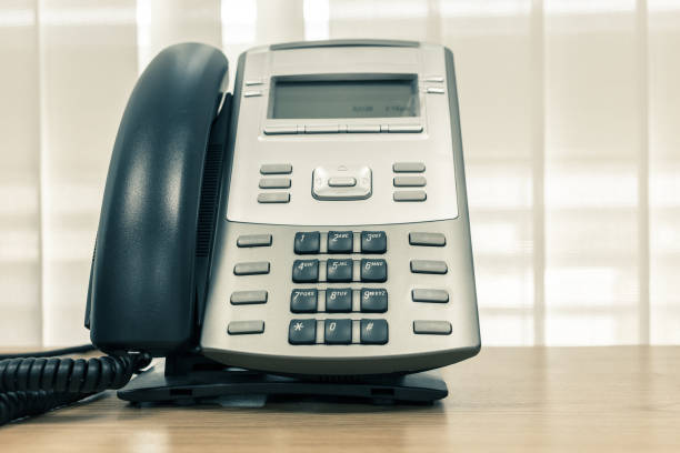 istock telephone on table work of room service business office 1084029018