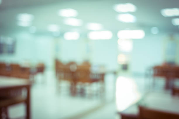 istock white room building decorated with chair and table, abstract blurred background 1084029054