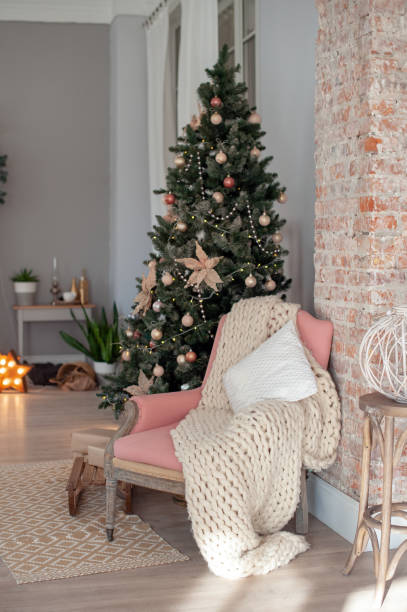 istock Christmas tree and chair near it 1084032032