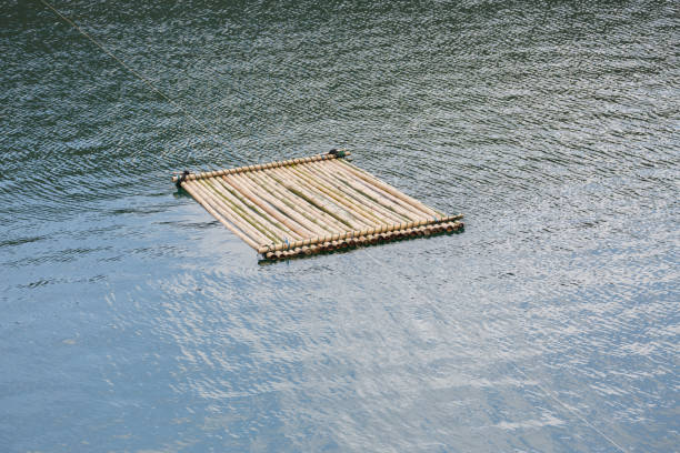 bamboo raft floating on water surface, travel in natural