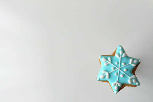 istock Decorated Christmas cookie shaped like a star snowflake 1084040166
