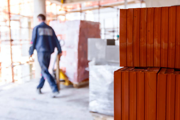 Piled resources of red blocks, packed in background