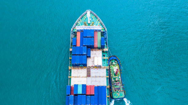 istock Container ship carrying container for import and export, Aerial view business logistic and transportation by ship in open sea. 1084040994