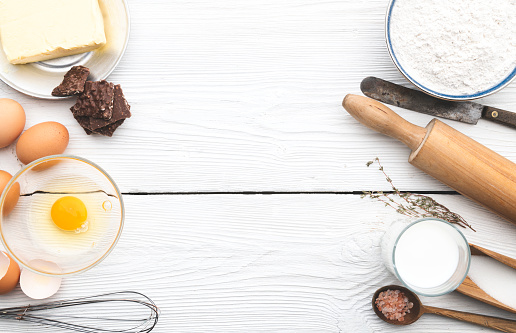 Ingredients for baking - milk, butter, eggs, flour and copy space