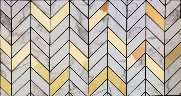 White marble tiles mixed with gold material pattern surface texture. Close-up of interior material for design decoration background