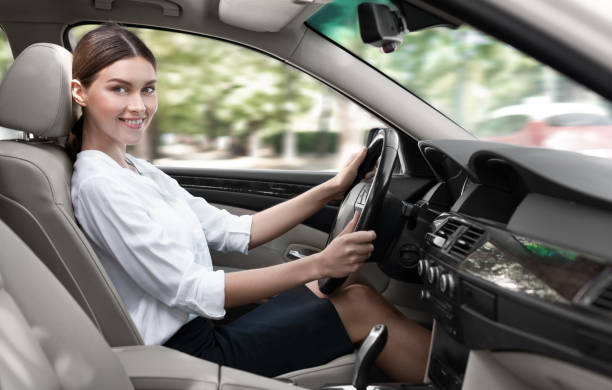 istock Business woman testing auto, sitting in cabin 1084043100