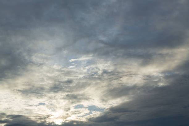istock monsoon weather dramatic moody rain storm sky with light in the darkness cloudy 1084043996