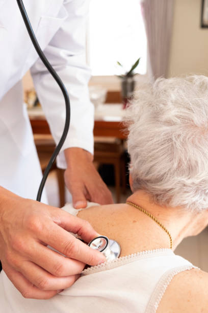 istock doctor examining a senior woman 1084045490