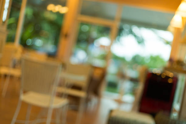 istock cafe coffee shop interior decoration with warm light, abstract blur background 1084046050