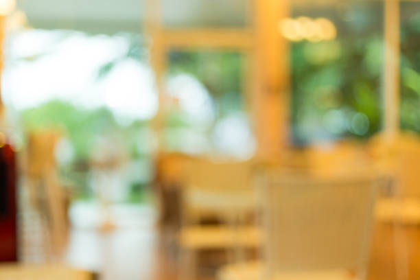 istock cafeteria interior decoration with warm light, abstract blur background 1084046066