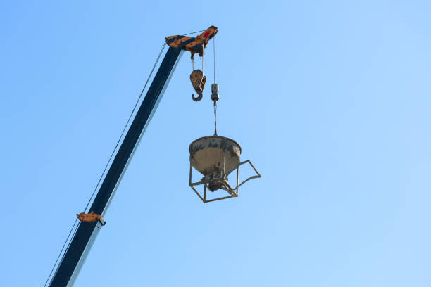 machinery crane hoisting cement mortar mixer bucket container in construction site building industry