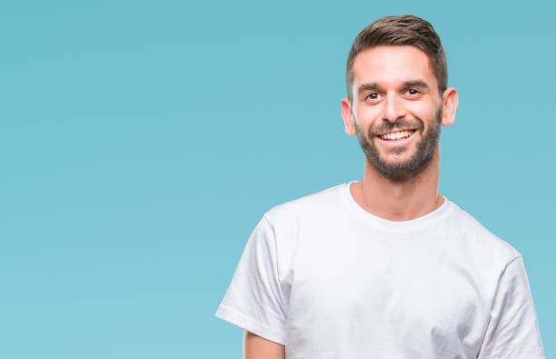 istock Young handsome man over isolated background looking away to side with smile on face, natural expression. Laughing confident. 1084050962