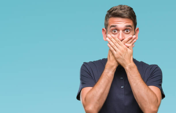 istock Young handsome man over isolated background shocked covering mouth with hands for mistake. Secret concept. 1084051278