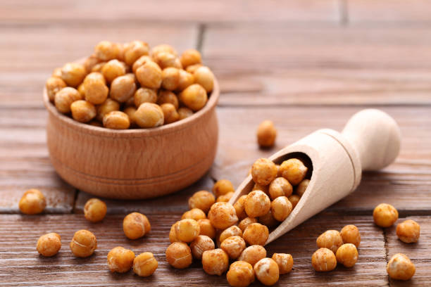 istock Roasted chickpeas in bowl and scoop on wooden table 1084054520
