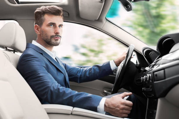 istock Man driving luxury car, shifting transmission gears 1084054628