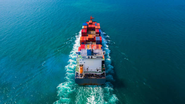 istock Container ship carrying container for import and export, Aerial view business logistic and freight transportation by ship in open sea. 1084057962