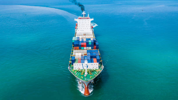 istock Container ship carrying container for import and export, Aerial view business logistic and freight transportation by ship in open sea. 1084057970