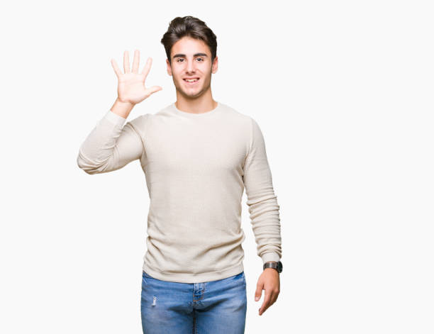istock Young handsome man over isolated background showing and pointing up with fingers number five while smiling confident and happy. 1084060140