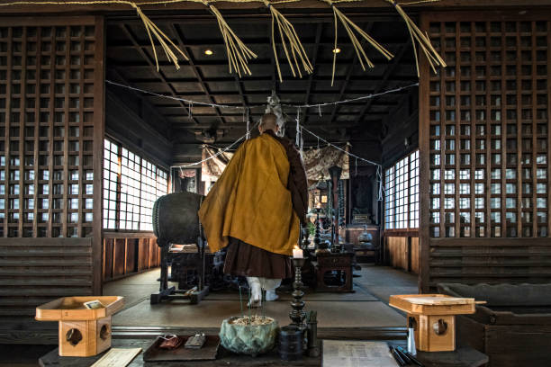 Zen Buddhism In Japan Buddhist monk is preparing to play Dharma Drum and praying at the Seiryuji Temple in Okayama Prefecture, Japan. rinzai zen buddhism stock pictures, royalty-free photos & images