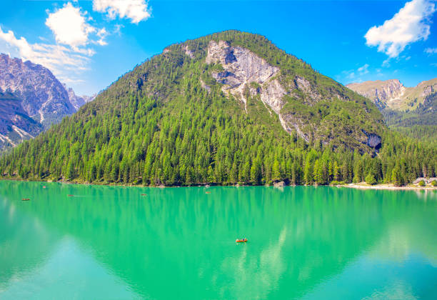 istock beautiful lake and green mountain 1084060760