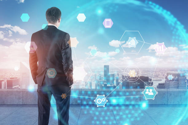istock Businessman looking at internet icons 1084060866