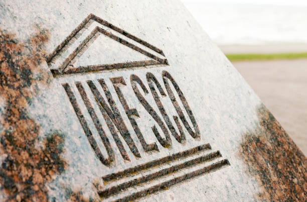 UNESCO world heritage sign carved on stone Juodkrante, Lithuania - 18 August, 2017: Close up picture of UNESCO world heritage sign or logo carved on stone unesco world heritage site stock pictures, royalty-free photos & images