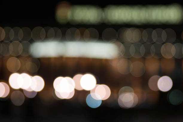 istock Many purple lights blurred bokeh background in the night. 1084063644