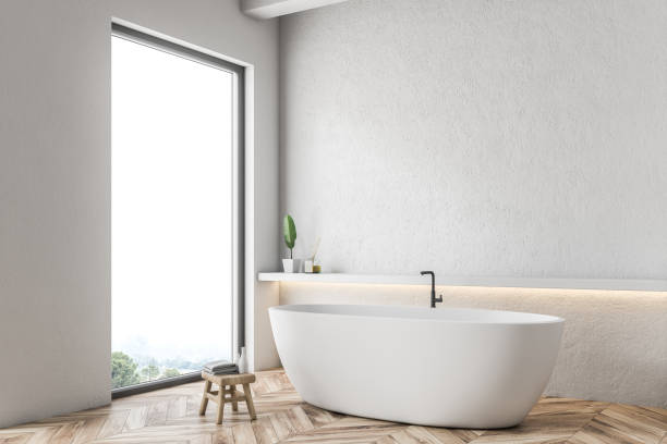 istock White tub in white bathroom corner 1084063988