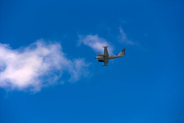 istock The plane flies against the blue sky 1084066608