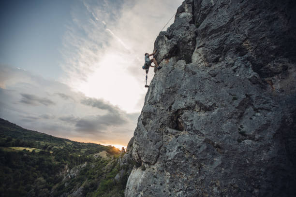 istock Disability guy on free climbing adventure 1084066676