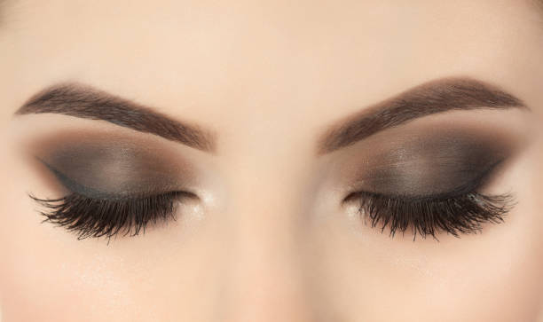 istock Beautiful woman with long eyelashes and with beautiful evening make-up. 1084068156