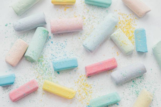istock Colorful chalk on white background . Kids education. Close up. 1084070742