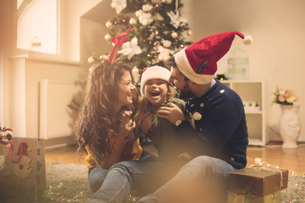 Smile is the most precious. Smile is the most precious. Family at home for Christmas holidays. merry christmas family stock pictures, royalty-free photos & images