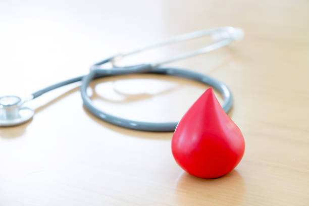 istock Stethoscope and a red blood  put on wooden 1084081308