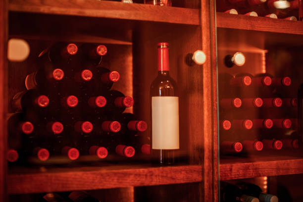 istock Wine cabinet with glass doors with wine bottles on a rack inside 1084083650