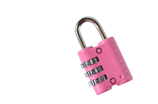 Isolated closed pink code lock for a suitcase on white background