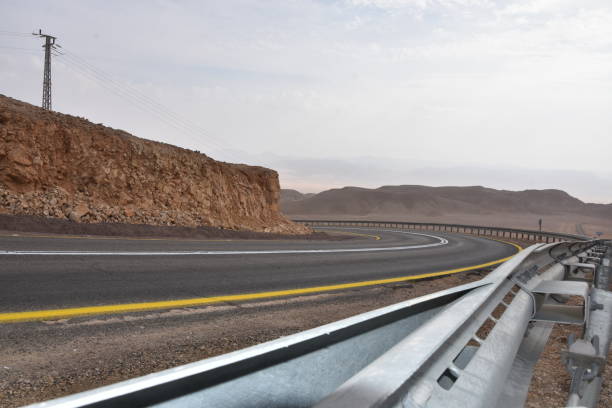 istock A winding road with safety railing 1084088326