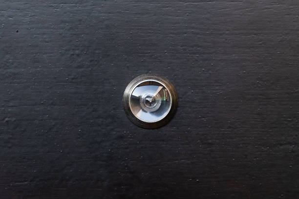 istock eye door for safety, security form steal concept 1084088386