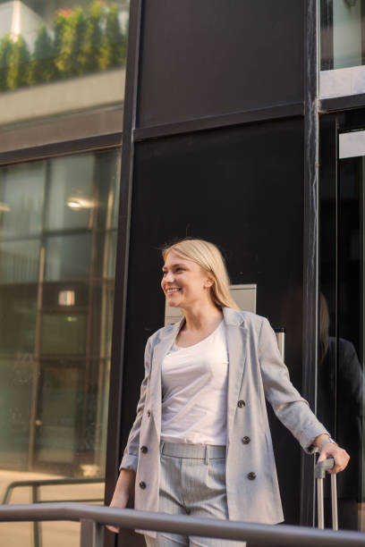 istock Businesswoman with suitcase. 1084088846