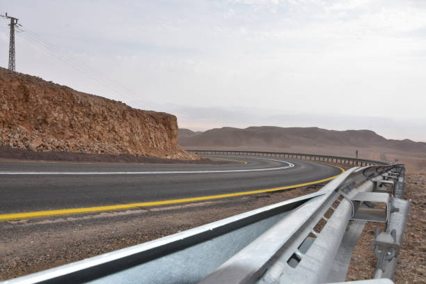 istock A winding road with safety railing 1084090936