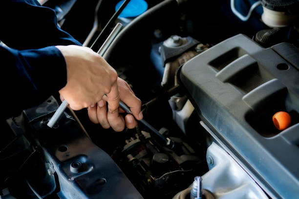 istock People are repairing a car. 1084091848