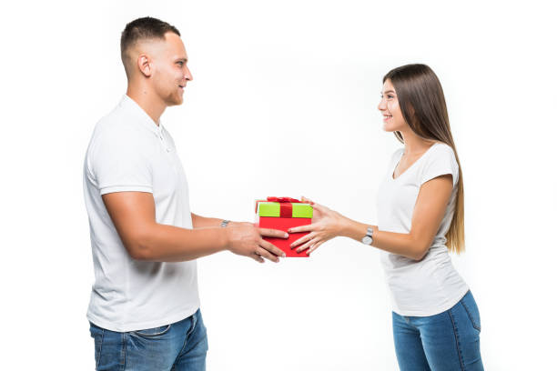 istock Handsome man makes present to his girlfriend, isolated on white background 1084092526