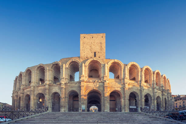 Arles Amphitheatre The roman Arles amphitheatre founded in 90 AD in Provence, France. The amphitheatre is a popular tourist destination in the city of Arles and a UNESCO world heritage site. amphitheater stock pictures, royalty-free photos & images