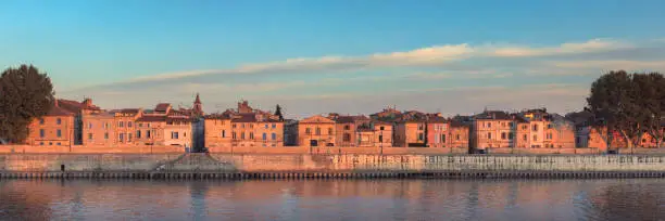 Buildings along the Rhône riverbank in Arles, France.