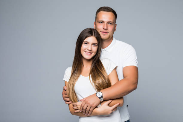 istock Happy loving couple isolated on gray background 1084094452