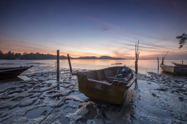 istock Boat Moored On Shore Against Sky During Sunset 1084094910
