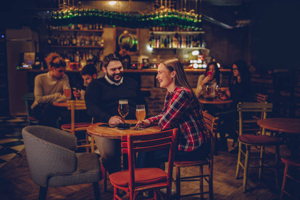 istock Group of friends in pub 1084095062